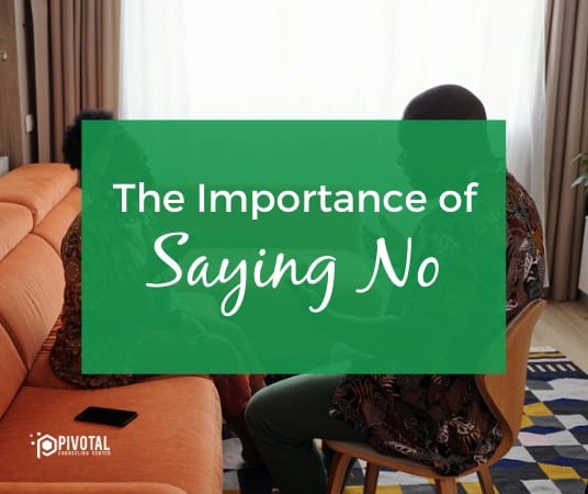 A stock photo of a young Black woman on an orange couch, talking to a Black man sitting on an orange chair opposite her. Over that is a partially transparent green rectangle and white text that reads The Importance of Saying No